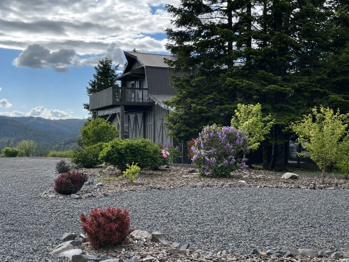 Residence east elevation, upper deck above the landscape beds