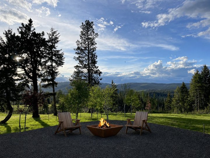 Backyard fire pit looking west across the valley at evening