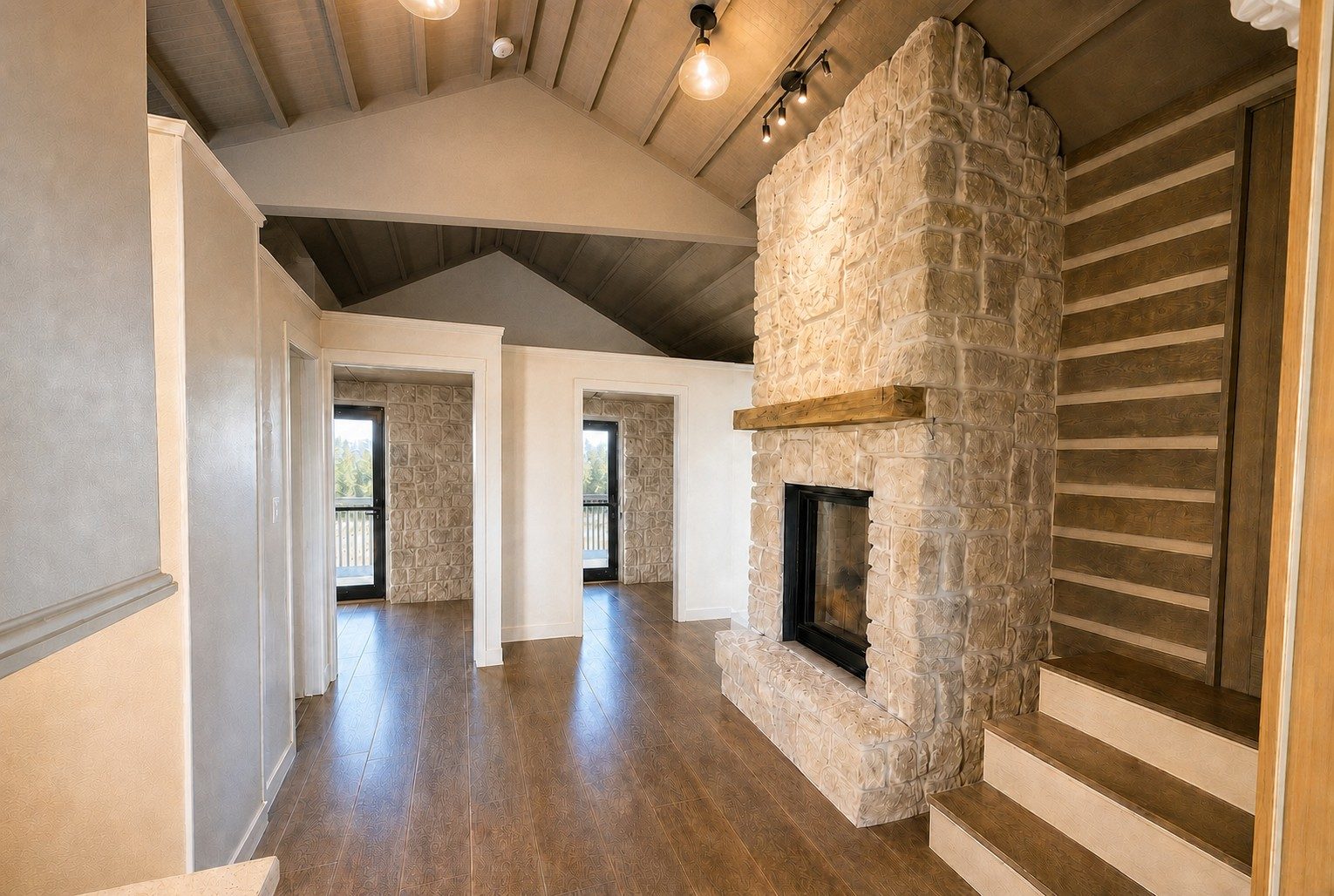 Upper Level living area with stone hearth, vaulted ceiling and hardwood floors